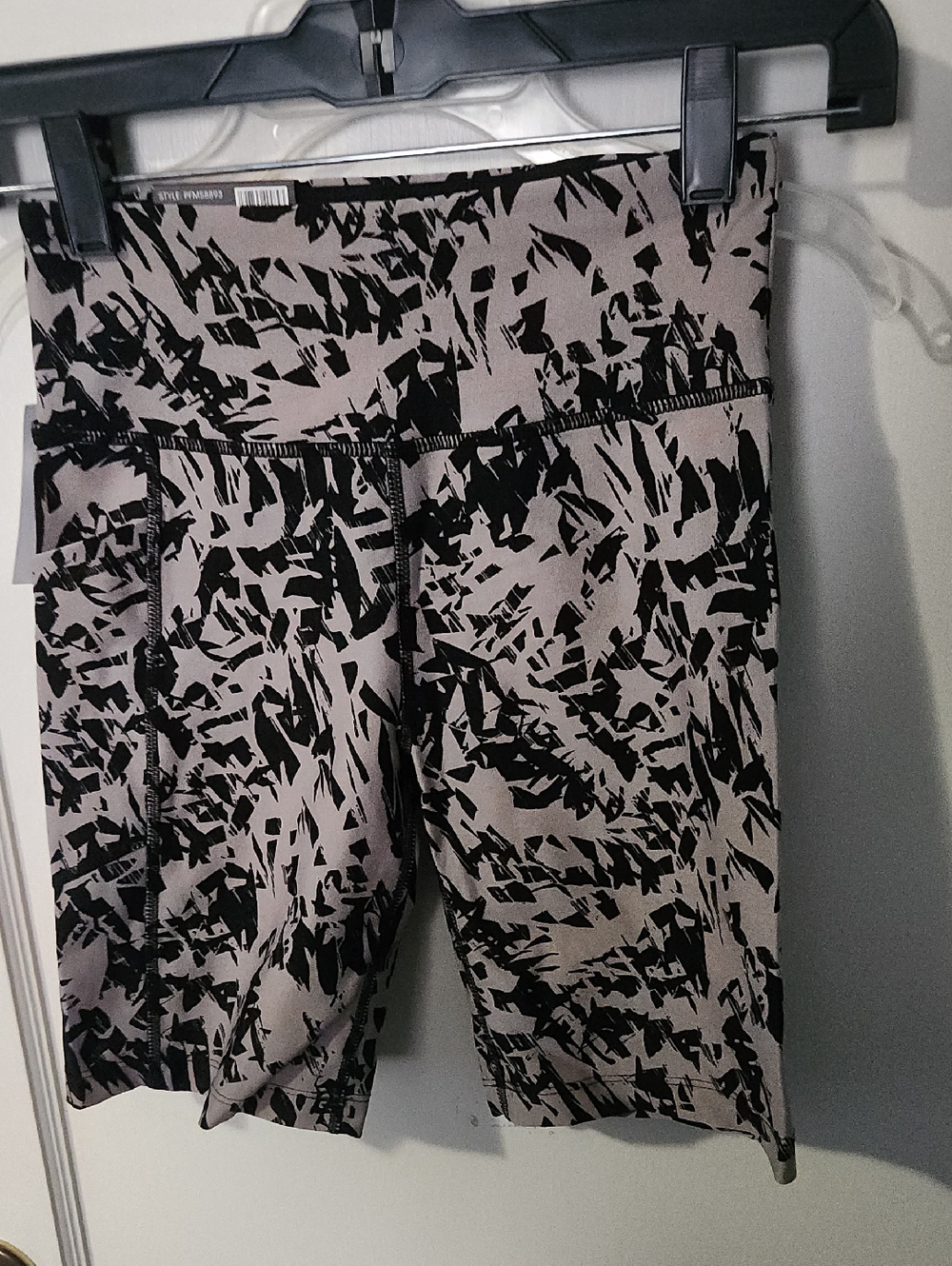 Calvin Klein Black Abstract Print Bike Shorts on Taupe Base